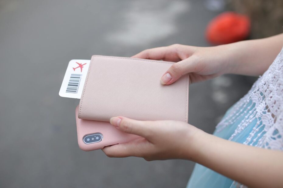 Boarding passes in a pink travel case